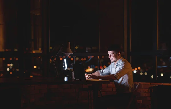 Happy Entrepreneur Guy Working On Laptop In Modern Office