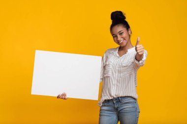 Friendly Black Girl Holding Blank Placard And Showing Thumb Up