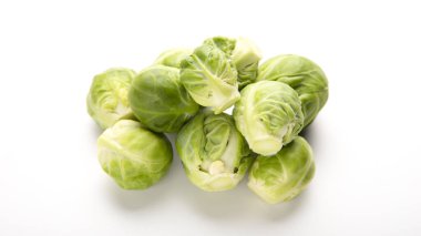 Heap of brussels sprouts on white background