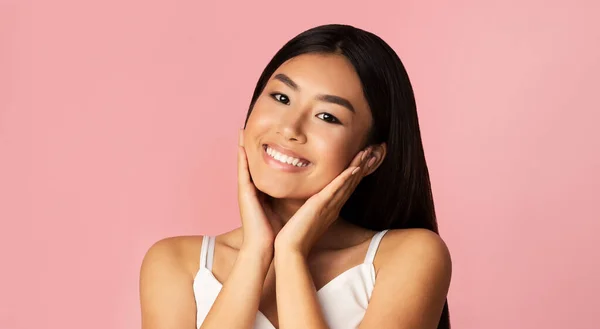 Beautiful Asian Girl Touching Face Smiling Posing On Pink Background — Stockfoto