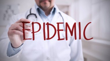 Doktor klinikteki hayali ekranda kelime salgını yazıyor.