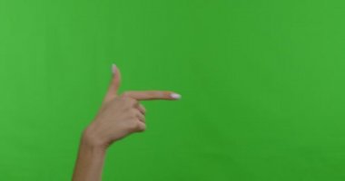 Woman hand pointing aside on copy space, chroma key background
