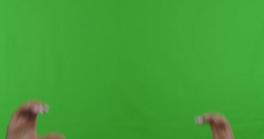 Female hands making heart symbol against chroma key background