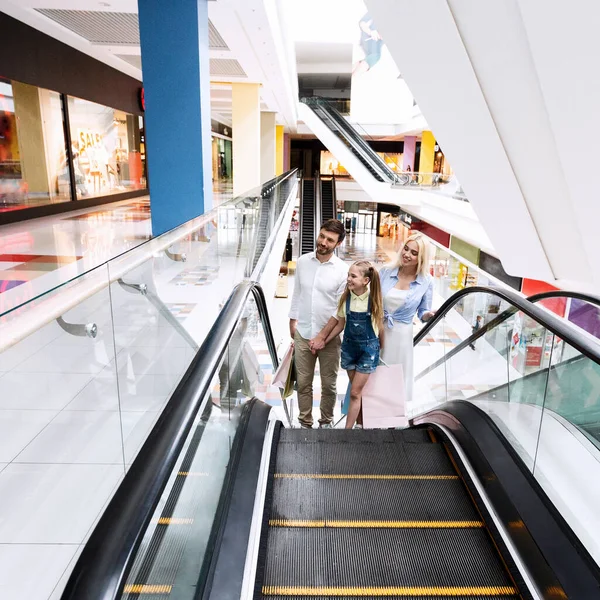 Family On Shopping Moving Up On Escalator Stairs In Hypermarket — Stock Photo, Image