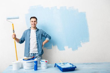 Homemade repairs concept. Man with painting tools