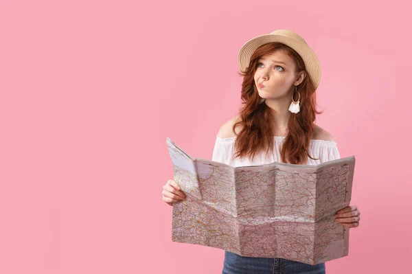 Thoughtful Tourist Girl Holding Map Posing Over Pink Studio Background — Stock Fotó