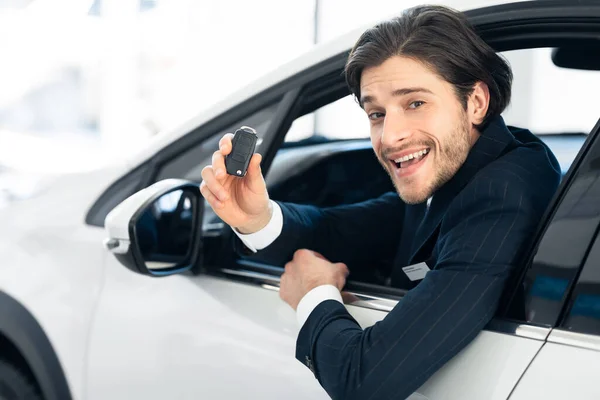 Businessman Showing Car Key Sitting In Drivers Seat — Stock Fotó