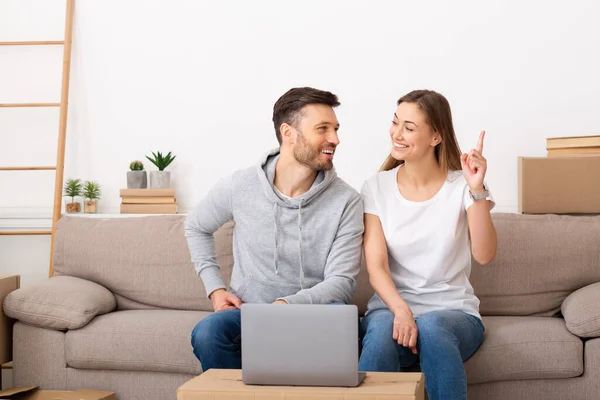Attractive young adult couple planning new home design — Stock Fotó