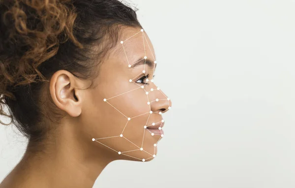 African American woman with scanning grid on her face against light background, panorama with blank space