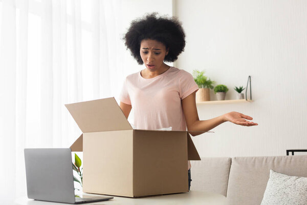 Mistake with order from online shop. Upset woman spreads hands