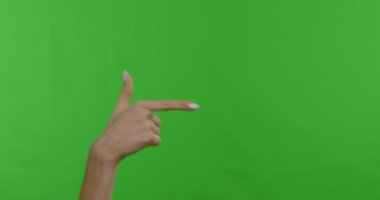 Woman hand pointing aside on copy space, chroma key background
