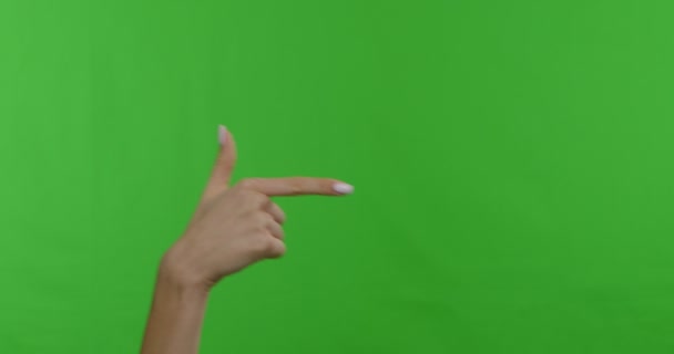 Woman hand pointing aside on copy space, chroma key background — Stok video
