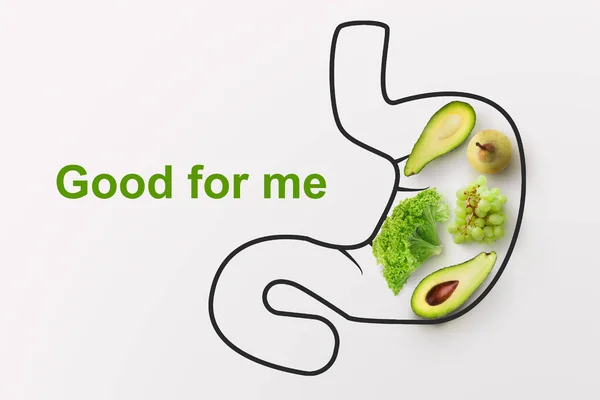 健康な消化器系のための食品.白い背景に胃の輪郭を持つ果物や野菜、創造的なコラージュ — ストック写真