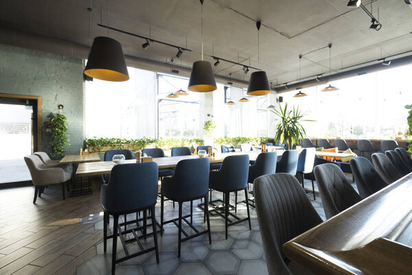 Cozy cafe interior with empty places for eating and resting