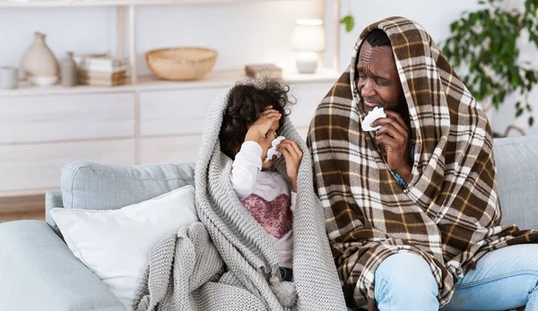 Contagious disease outbreak. African American girl with granddad having bad virus at home, panorama. Copy space