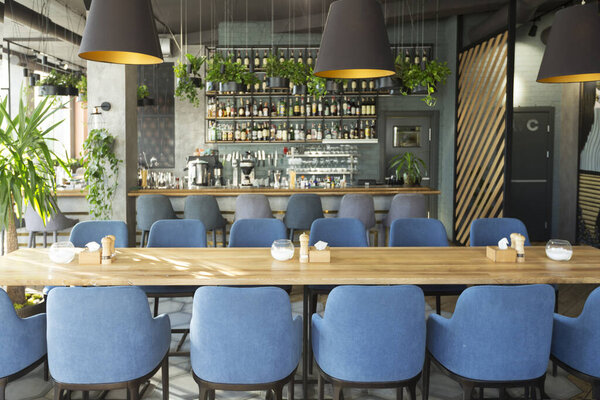 Modern cafe with places for rest and eating with big counter