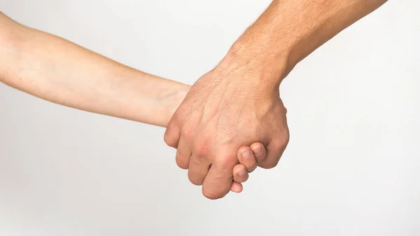 Father and son holding hands, white studio background — Stock Photo, Image