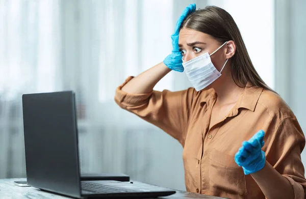 Woman wearing mask and gloves reading news