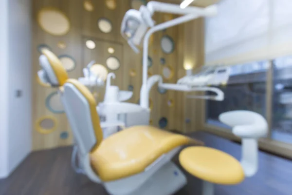 Cadeira borrada para crianças na sala de odontologia — Fotografia de Stock