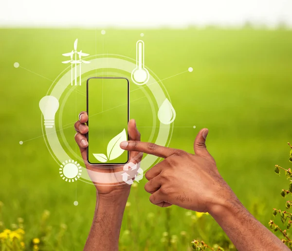 Grön levande teknik. Kreativ collage med man pekar på växt symbol bland ekologiska ikoner på mobiltelefon — Stockfoto