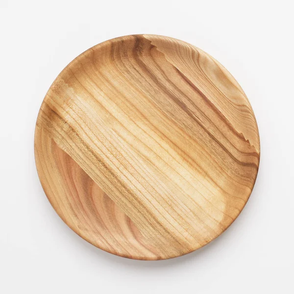 Wooden plate on white background, close up — Stock Photo, Image