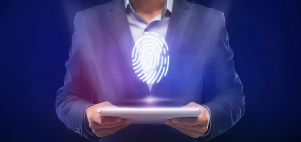 Businessman Holding Digital Tablet With Fingerprint Verification Access, Blue Background