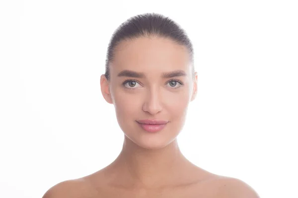 Young woman looking at camera at studio — Stock Photo, Image