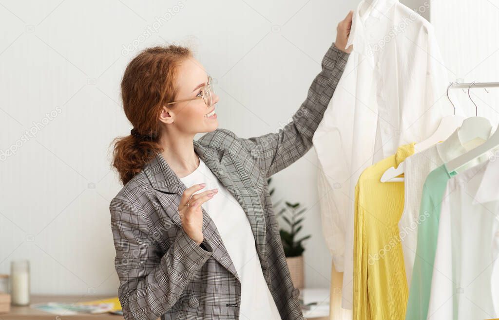 Millennial Girl Shopping Buying New Clothes In Showroom