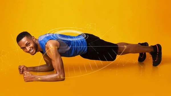 Ajuste hombre afroamericano haciendo ejercicio de tablón sobre fondo naranja, collage. Panorama —  Fotos de Stock