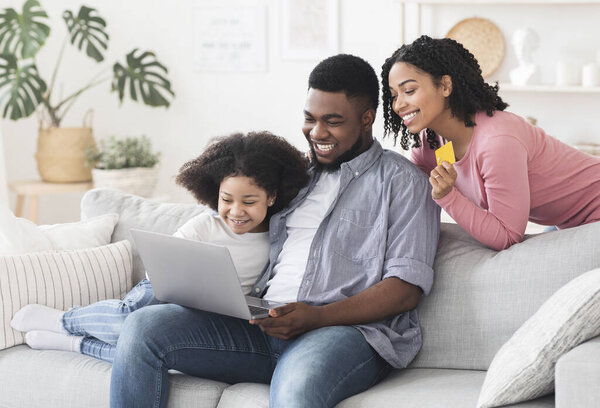 Online Shopping. Cheerful Black Family Ordering Groceries Delivery In Internet