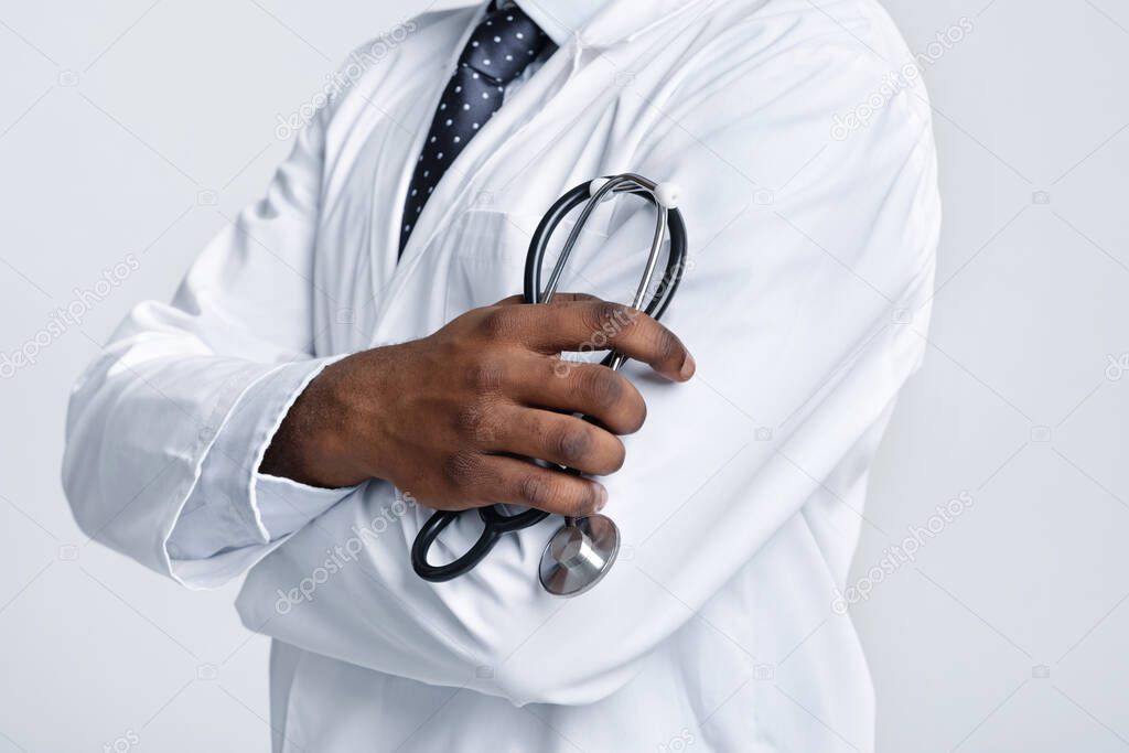 Cropped of african american doctor holding stethoscope