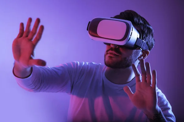 Hi-tech entertainment. Man in virtual reality glasses.