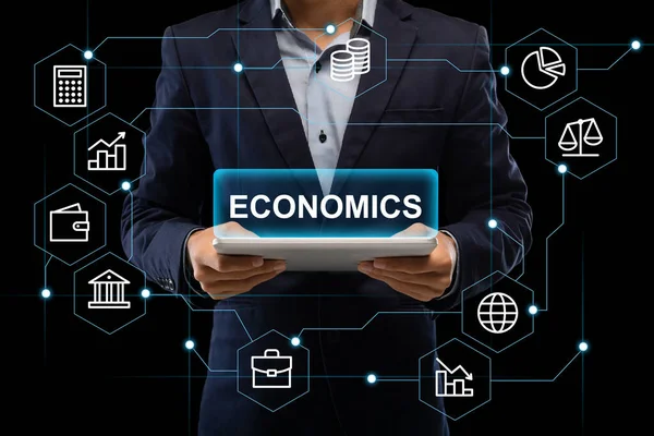 Mans hands holding tablet with inscription economics — Stock Photo, Image