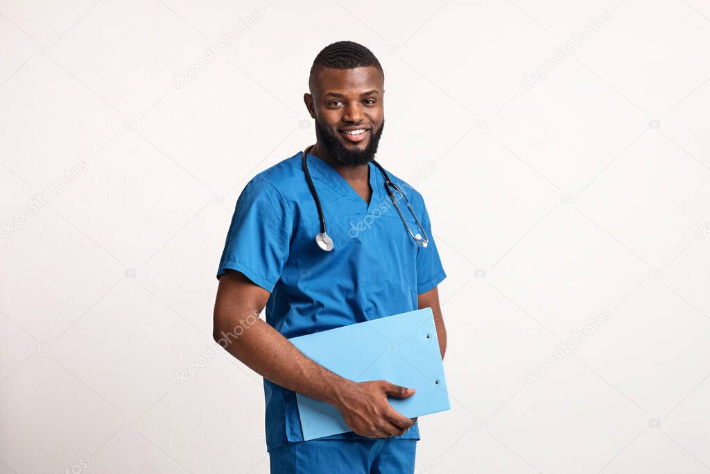 Young friendly african doctor holding medical chart