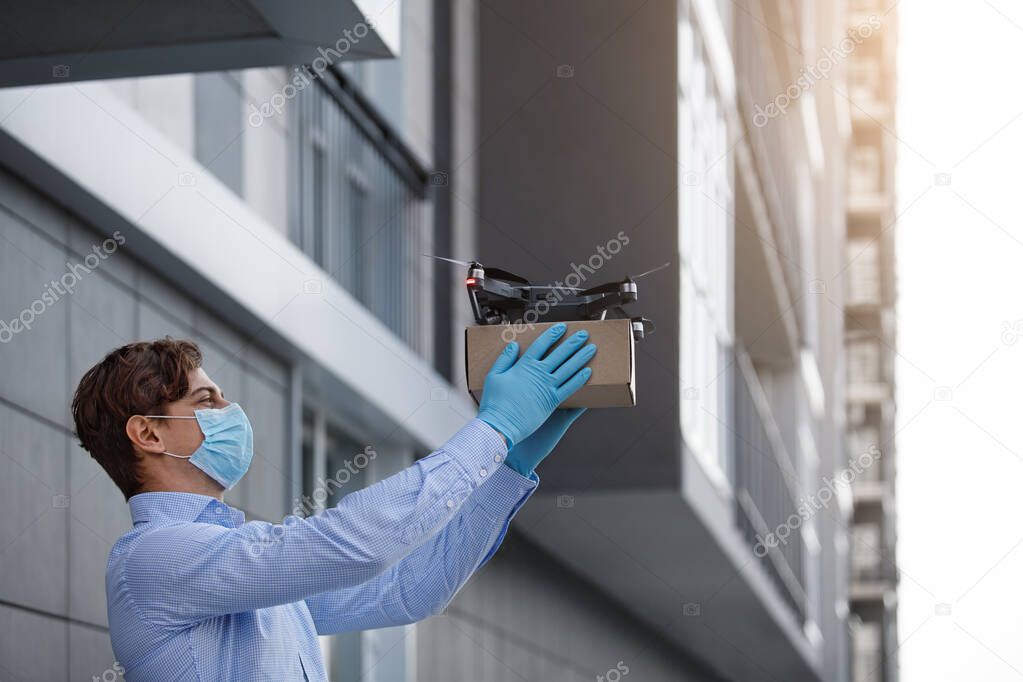 Man launches a quadrocopter with a package for his relatives