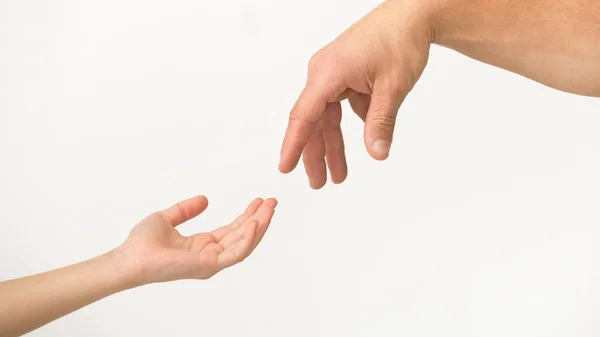 Adult and kid hands reaching to each other — Stock Photo, Image