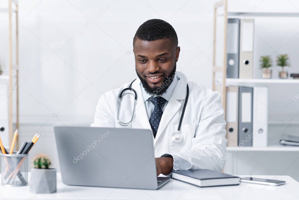 Highly qualified black doctor consultating patients online