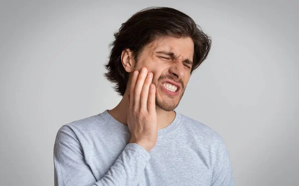 Man suffering from terrible strong teeth pain — Stock Photo, Image