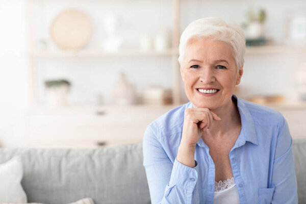 Carefree Retirement. Portrait Of Happy Beautiful Senior Lady Posing At Home