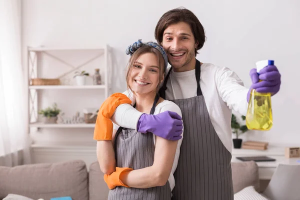 Romantic Couple Tidying Flat Together, Hugging And Posing To Camera — Stock Photo, Image