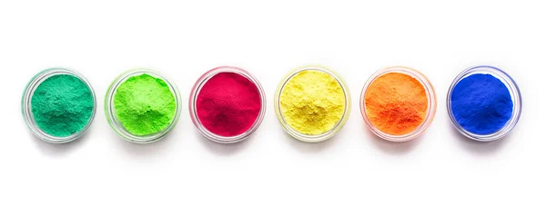 Élénk piros, kék, zöld és sárga színű élelmiszer por fehér alapon — Stock Fotó