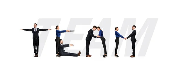 Group of people forming team word at studio — Stock Photo, Image