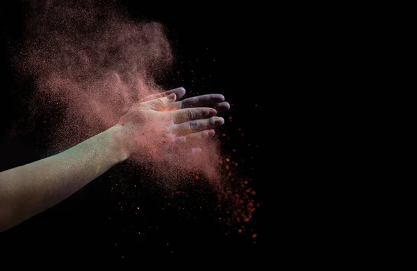 Clap hands during Holi. Red cloud of dry paint — Stock Photo, Image