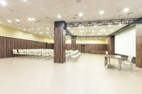 Cnference room with speaker table and screen