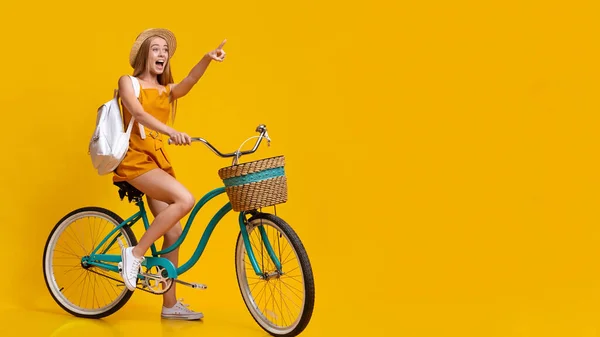 Summer Sale. Excited Girl Riding Bicycle And Pointing Aside At Copy Space — Stock Photo, Image