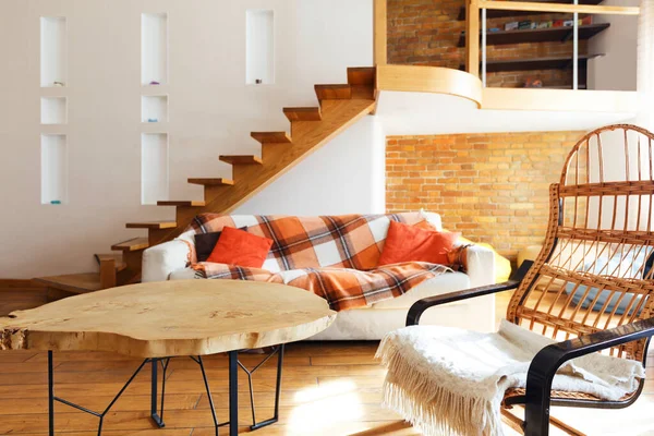 Modern cozy loft. Chair, table and sofa