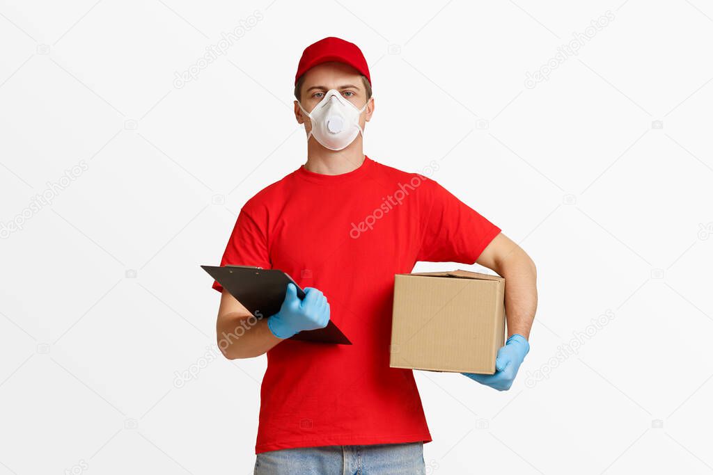 Home delivery of parcels by courier. Delivery man in protective mask and gloves