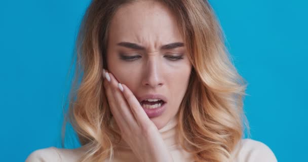 Woman suffering from strong tooth pain, close up — Stock Video