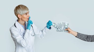 Woman doctor in medical gloves takes money from patient hands and makes sign of silence clipart