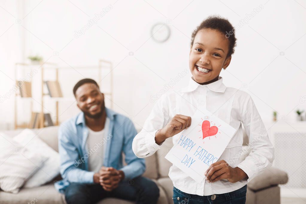 Fathers Day. Happy Daughter Preparing Greeting Card